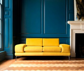 A yellow office sofa sits in front of a blue wall.