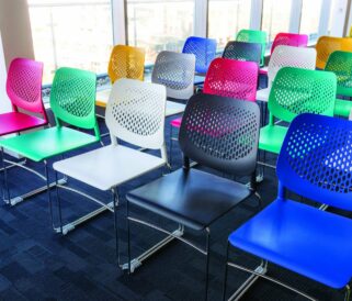 A row of colourful chairs in a room.