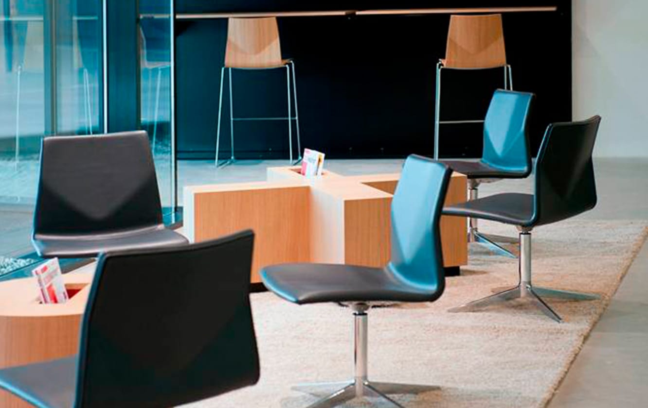 A group of black chairs in a conference room.