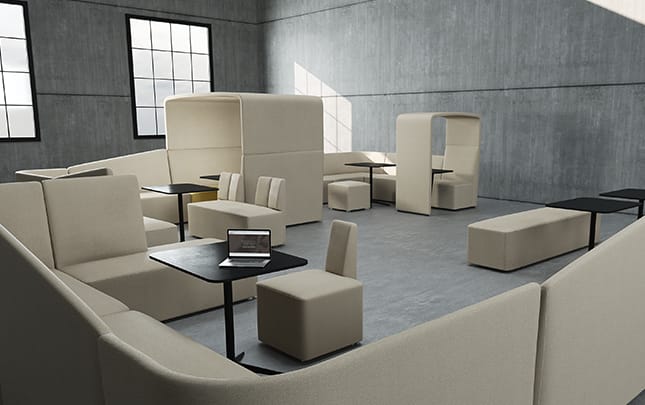 A group of chairs and office sofas in an office space.