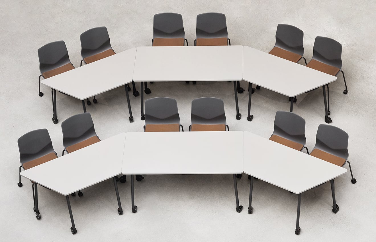 A group of meeting table chairs and tables arranged in a circle.