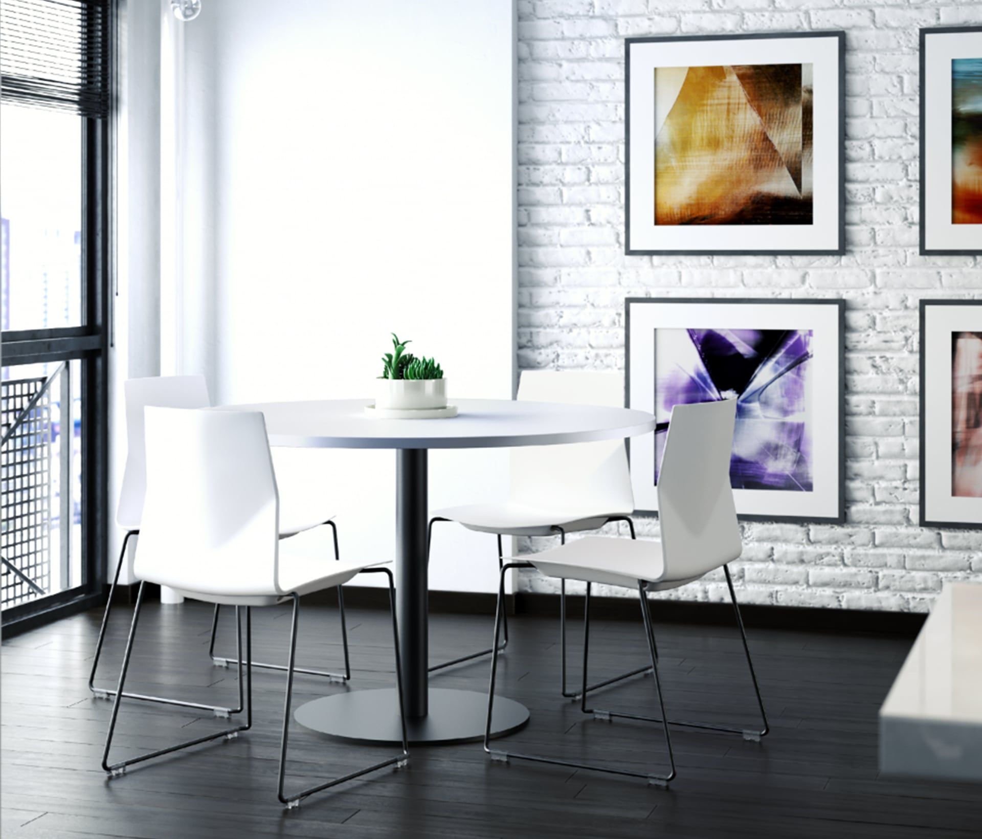 A white table and chairs in a room with framed pictures.