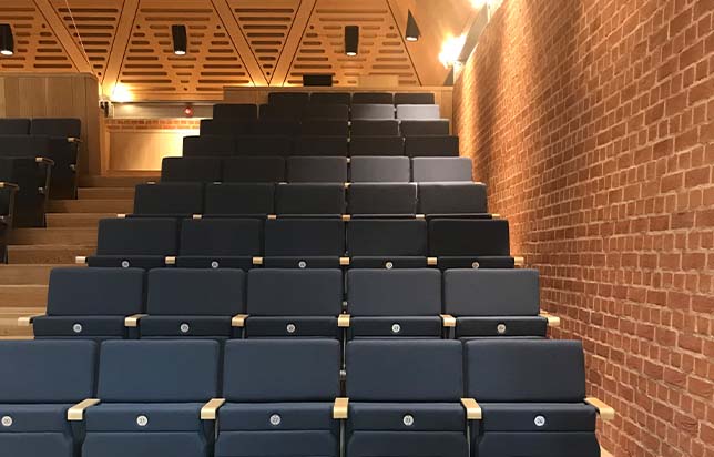 A large auditorium with rows of auditorium seating