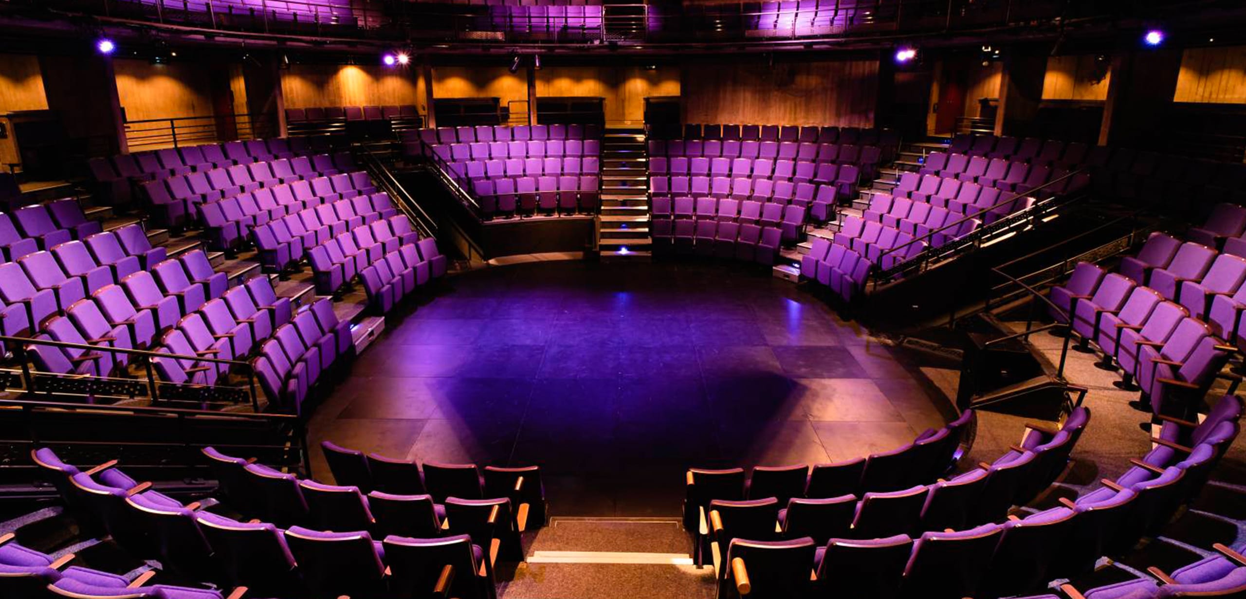 A large auditorium with purple auditorium seating