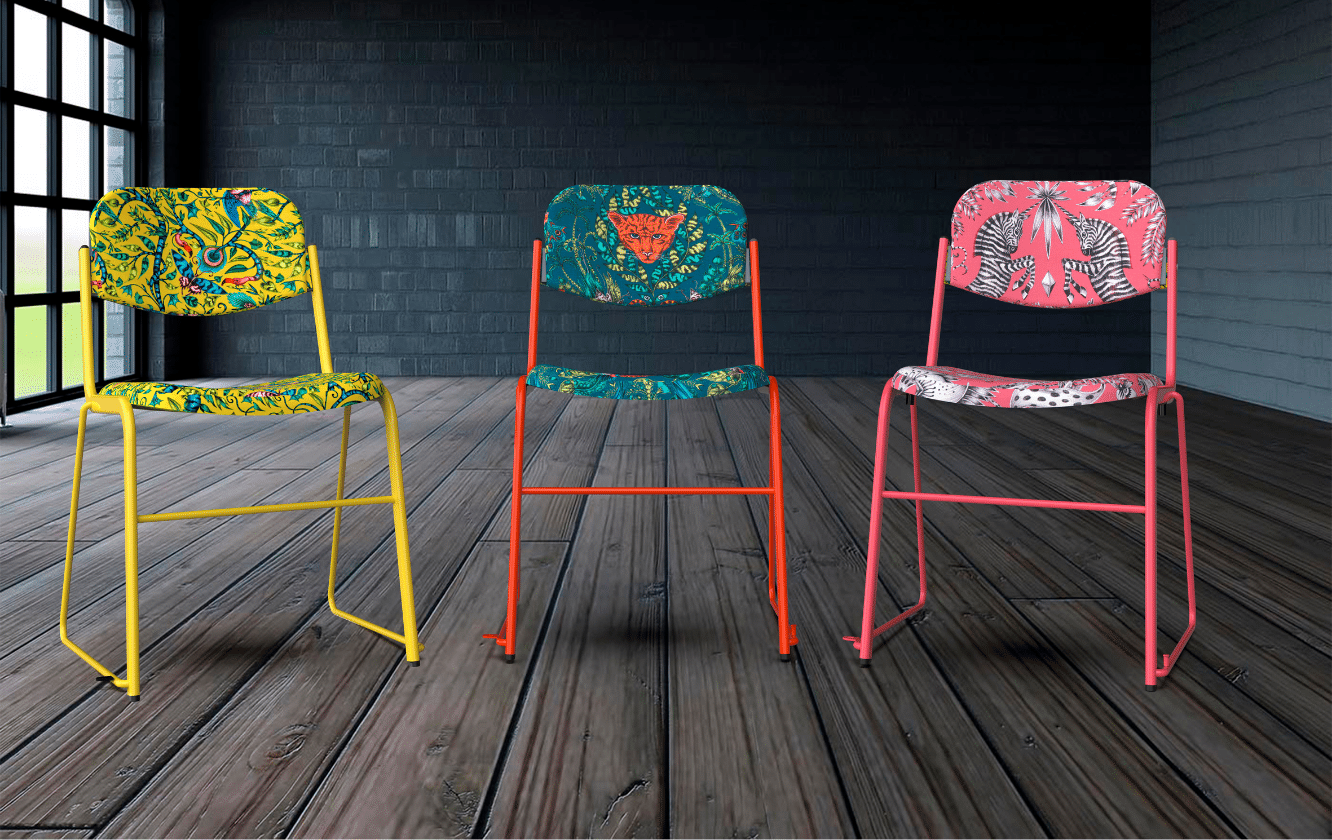 Three colourful bespoke seating chairs in a room with a wooden floor.