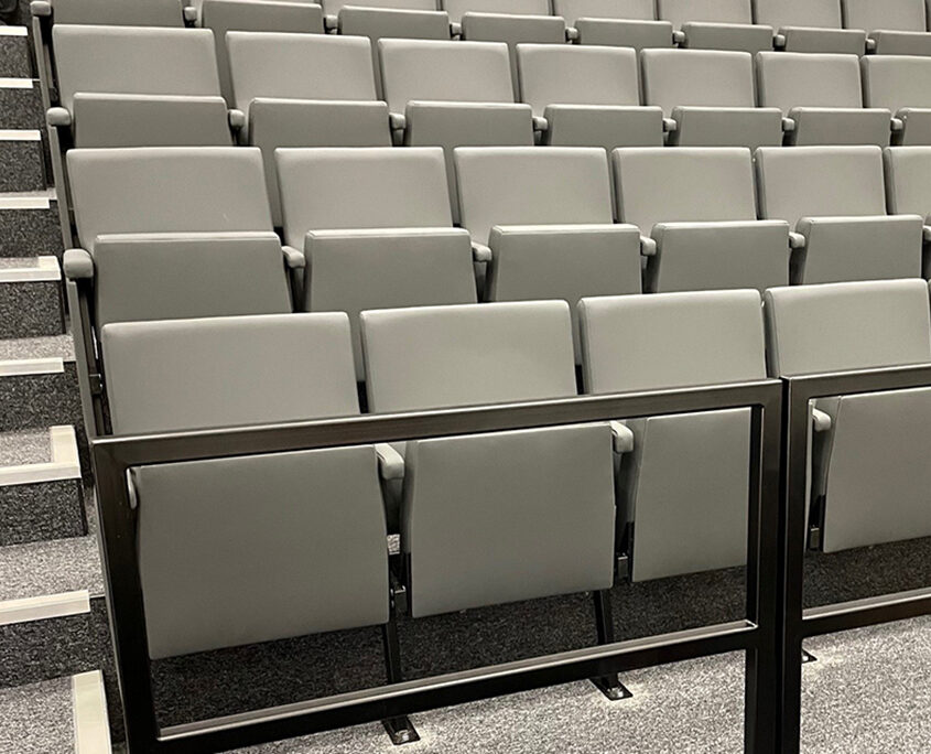 A large auditorium with rows of auditorium seating